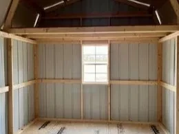 a window under a 4' loft inside a metal lofted barn