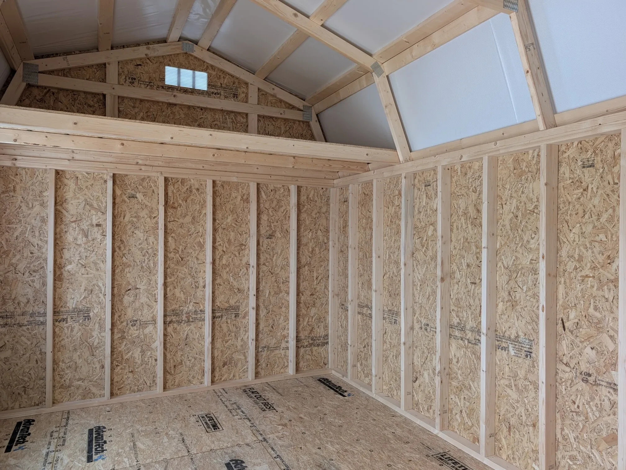 looking up at the loft inside a wood side lofted barn on the left