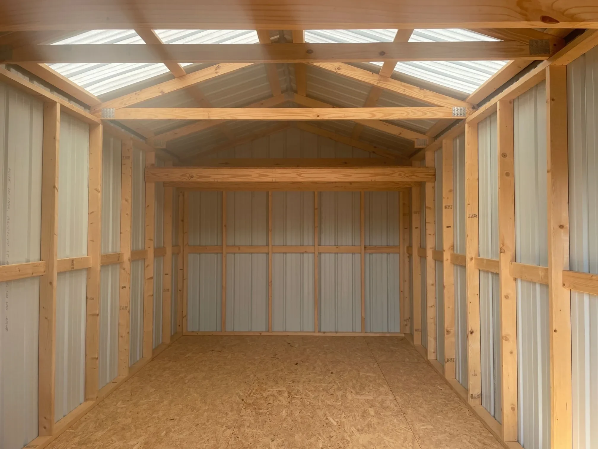 the interior of a long metal barn