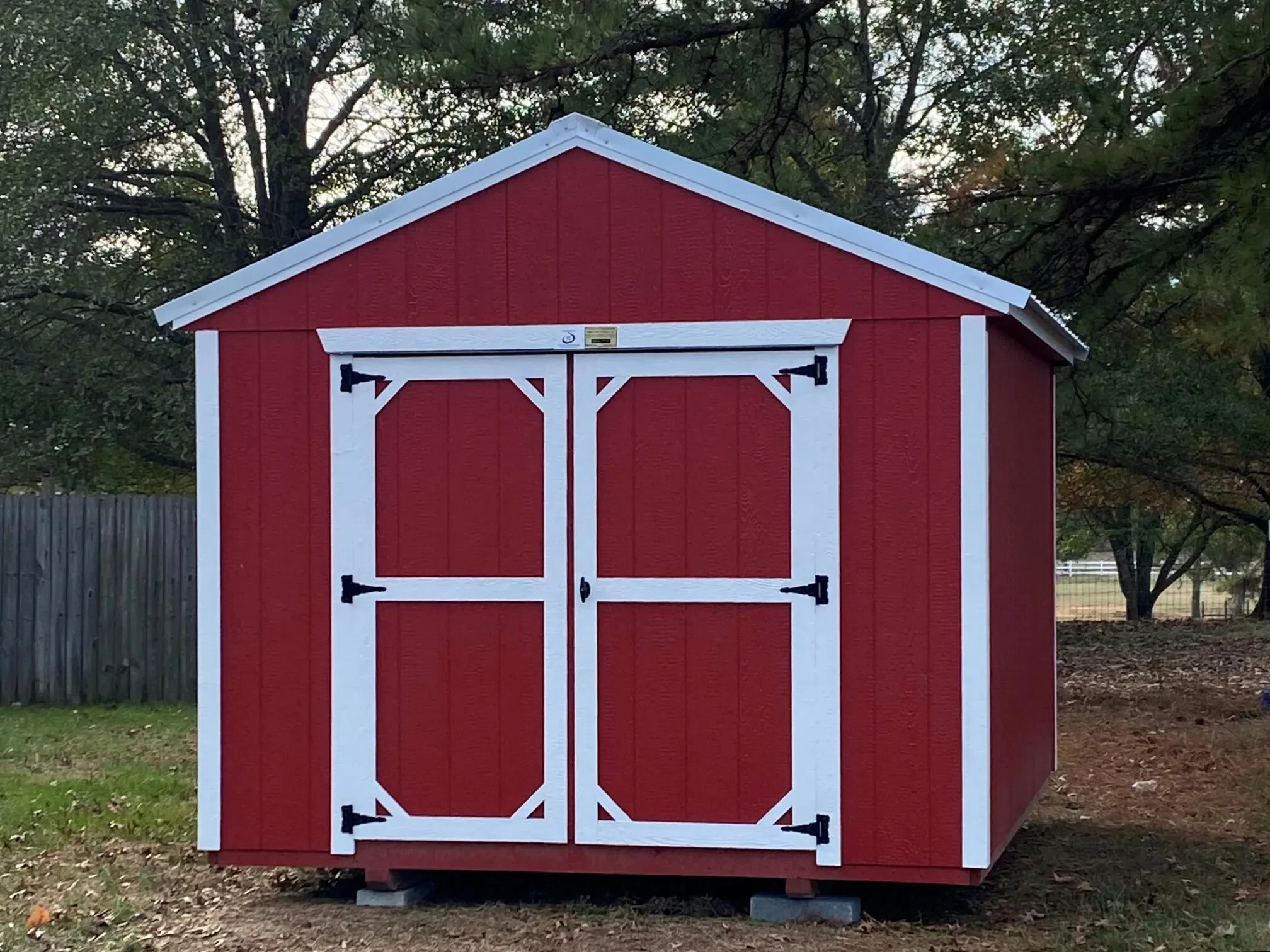 a red and white backyard shed