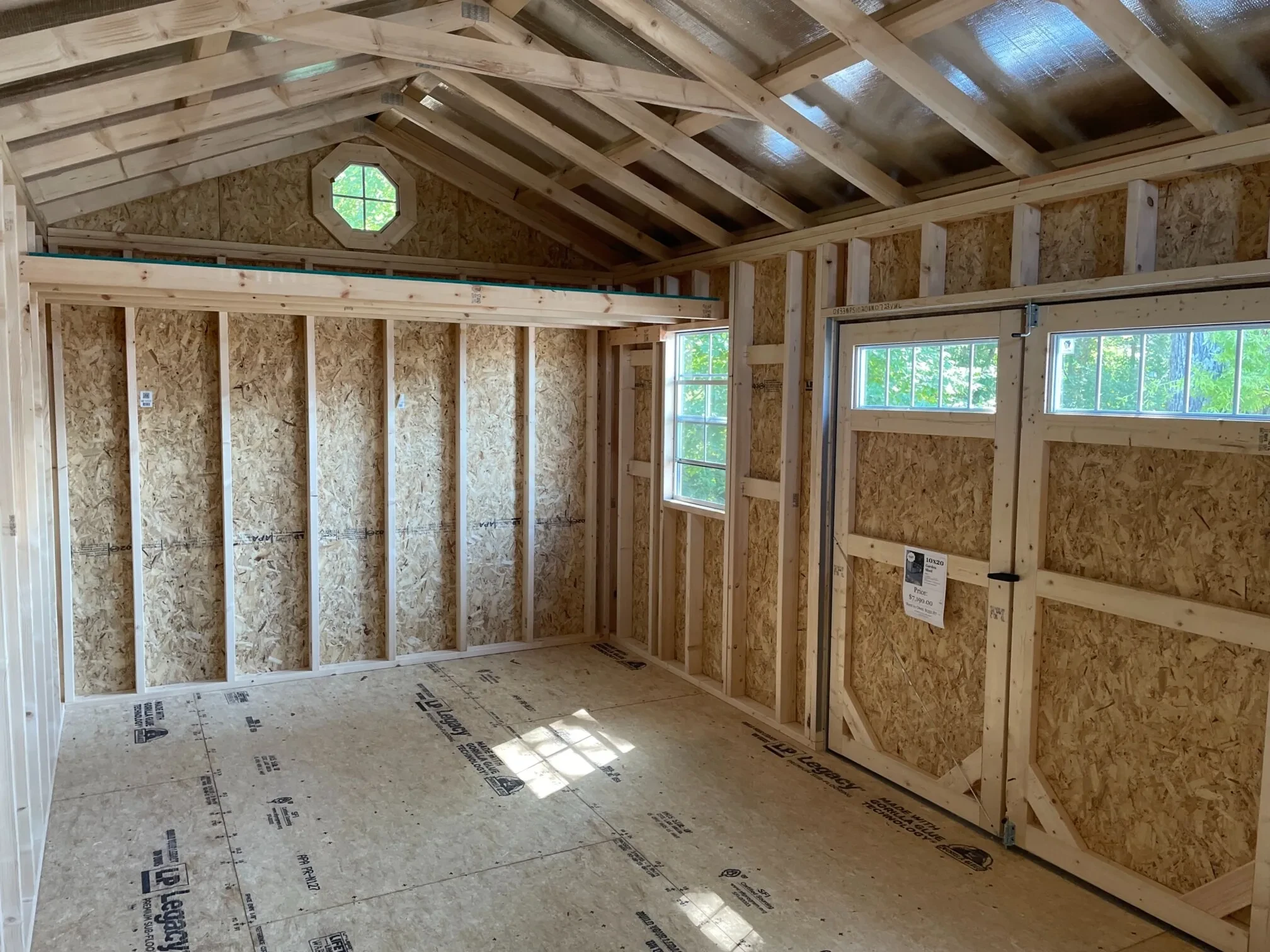 the right ride of the interior of a wood garden shed with transom windows, octagon windows, and a 2x3 window