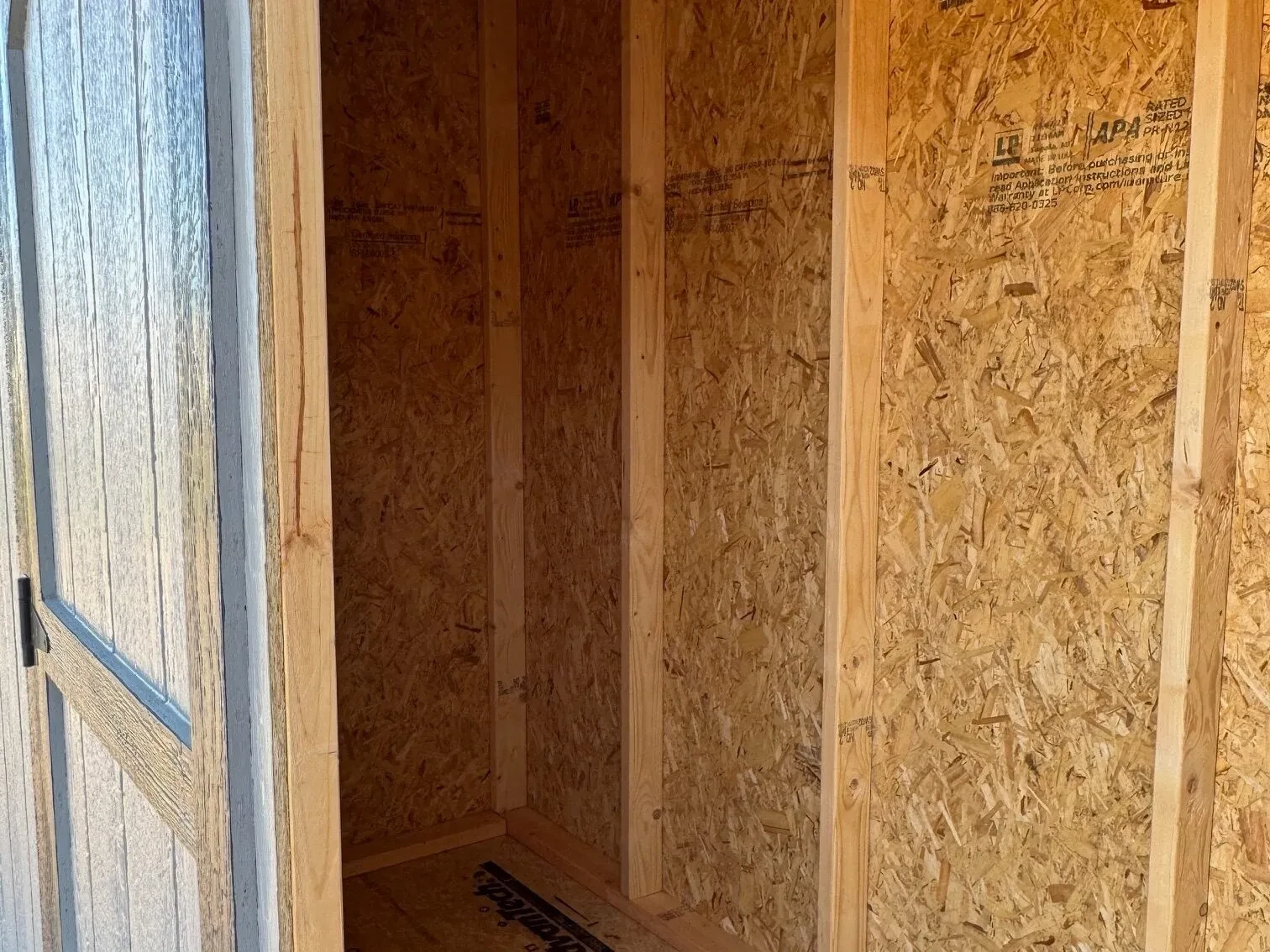 inside a small wood leanto style shed