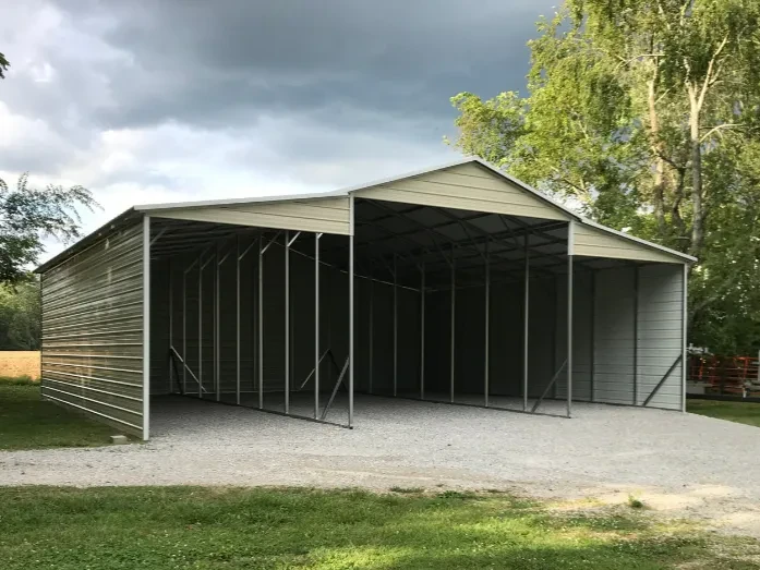 a stone Tennessee barn style carport with a central section and two attached lean-tos