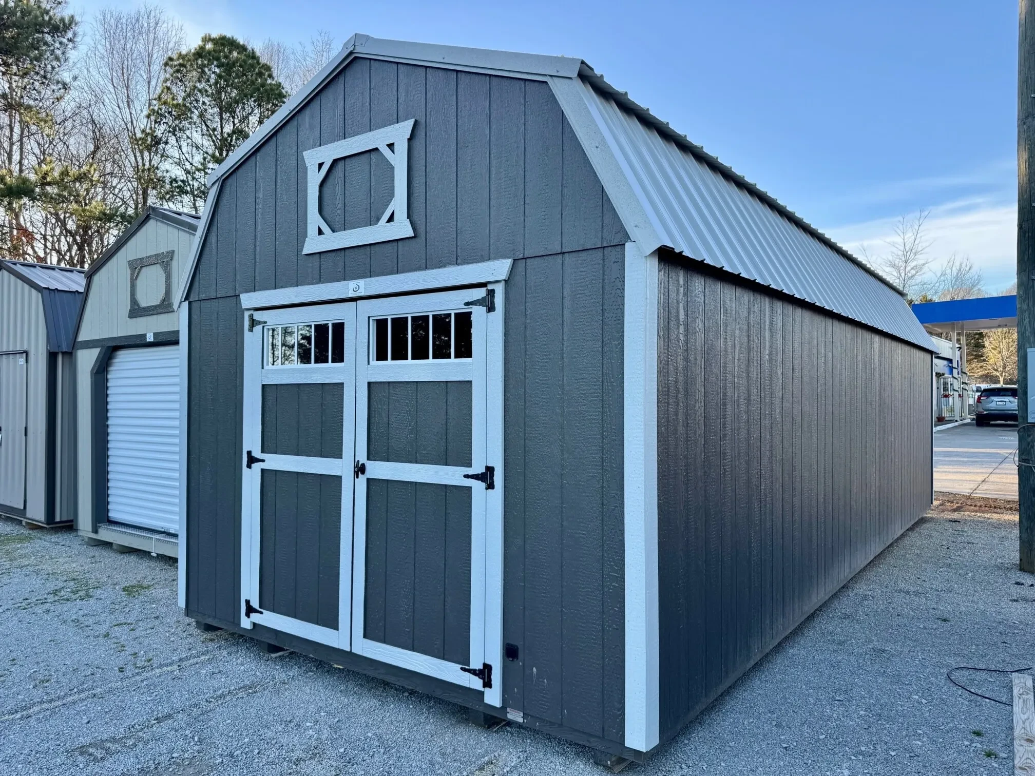 a large lofted barn with transom windows on the double doors