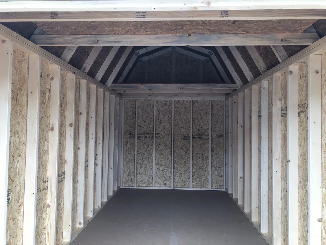 the interior of a lofted barn with a loft on the back wall