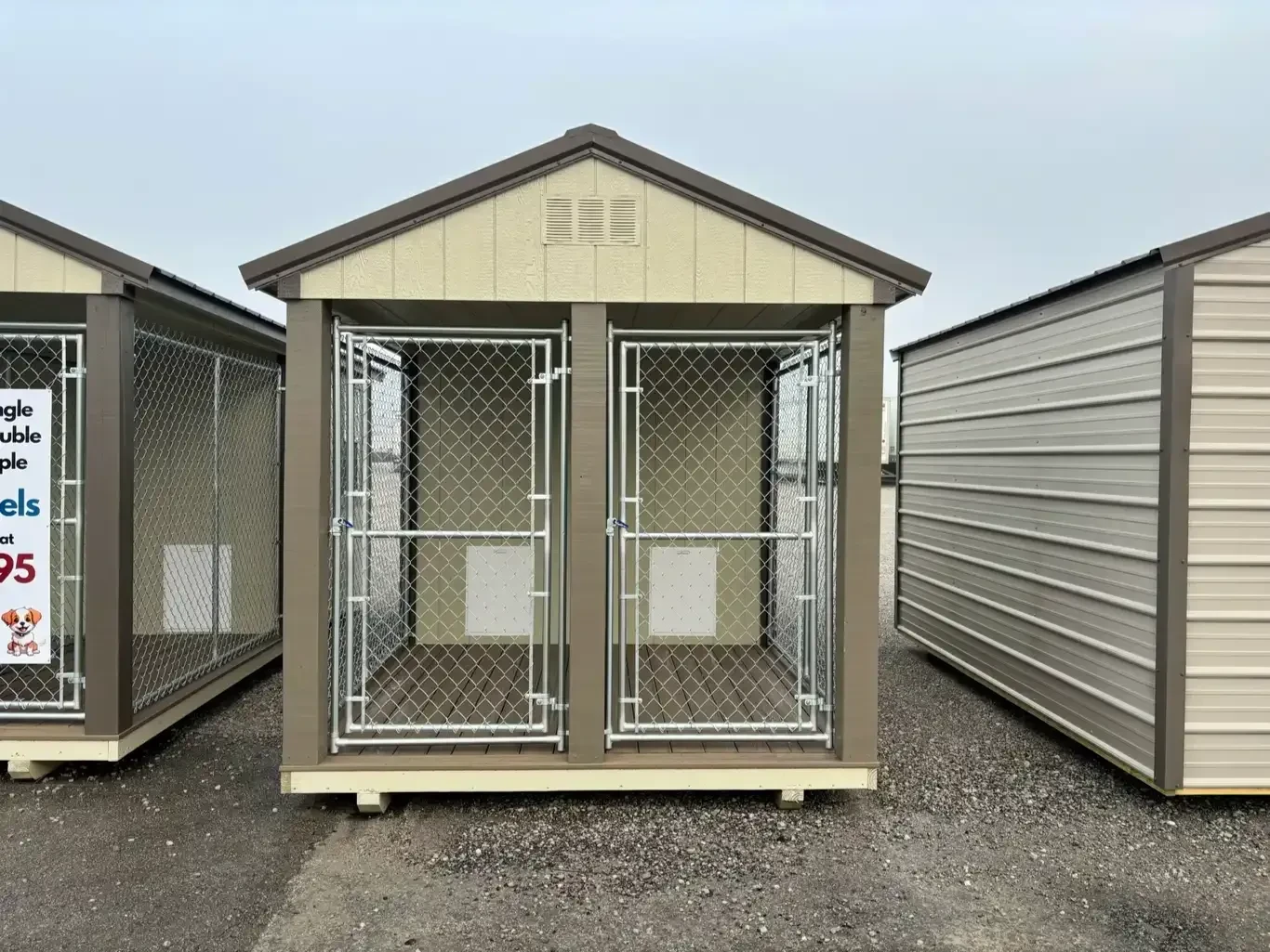a 2-bay dog kennel with chain-link runs