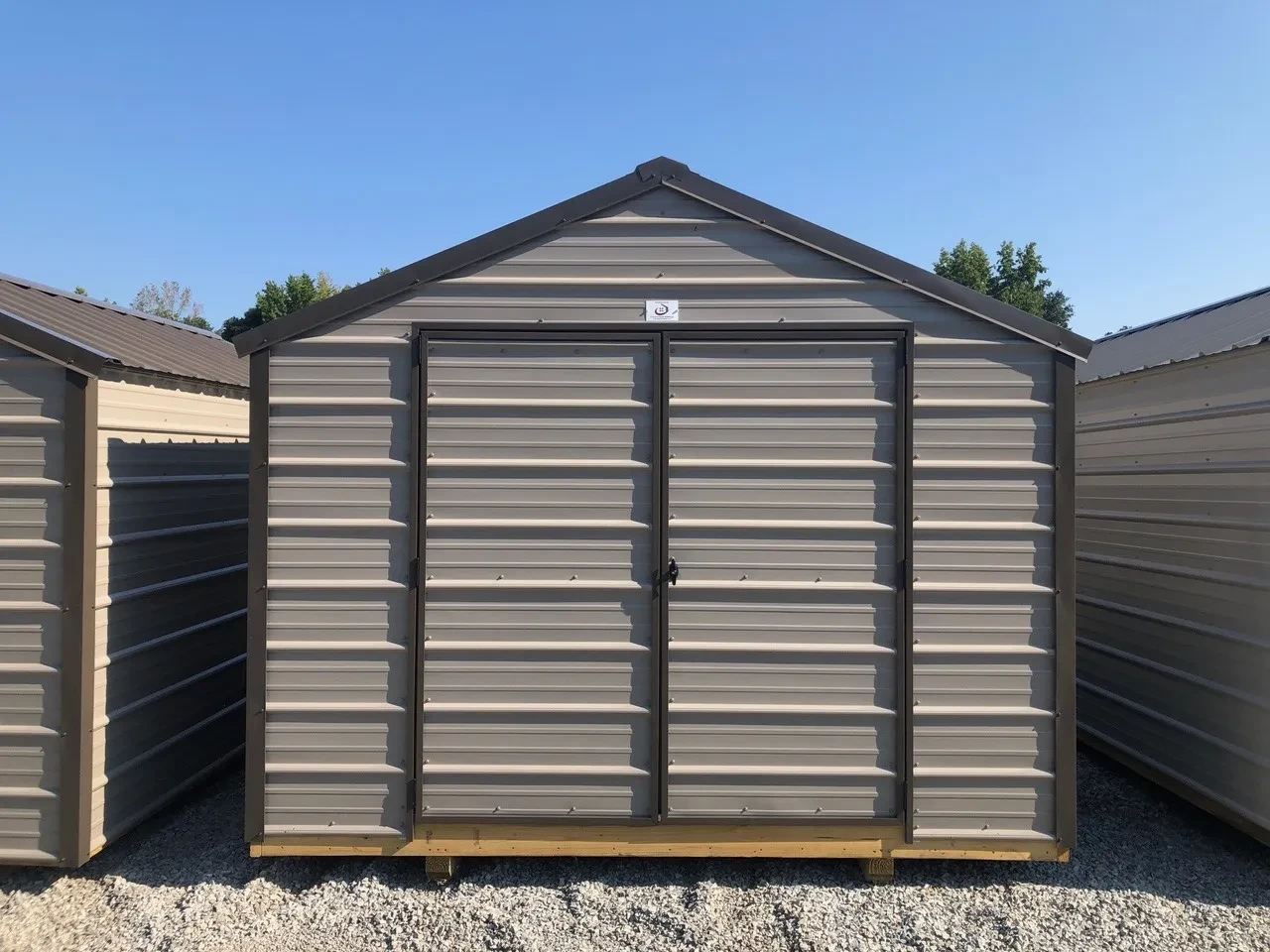 a metal shed with double doors and horizontal metal on the walls and doors