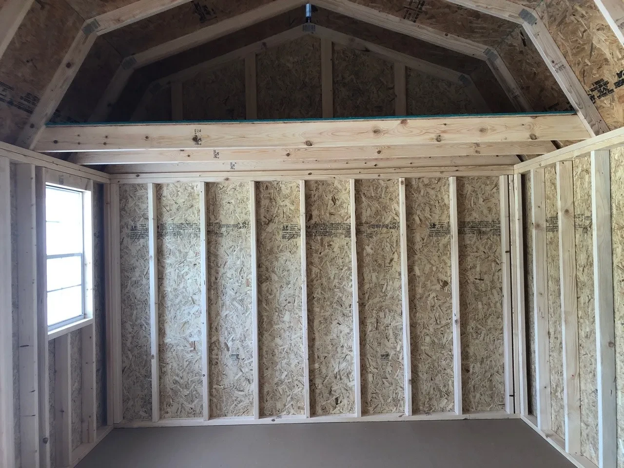 a loft on the left inside wall of a side lofted barn