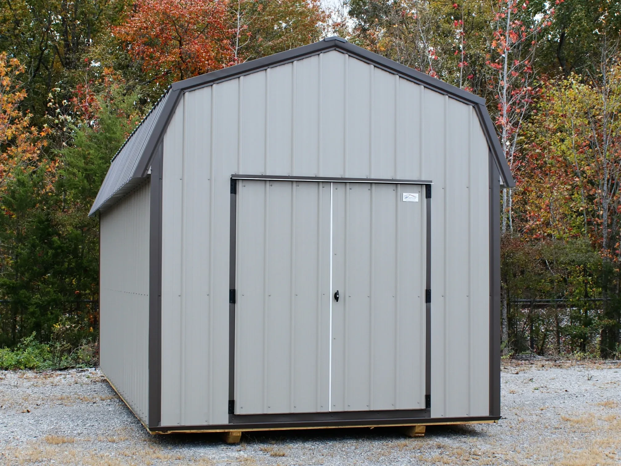 a lofted metal shed with double doors