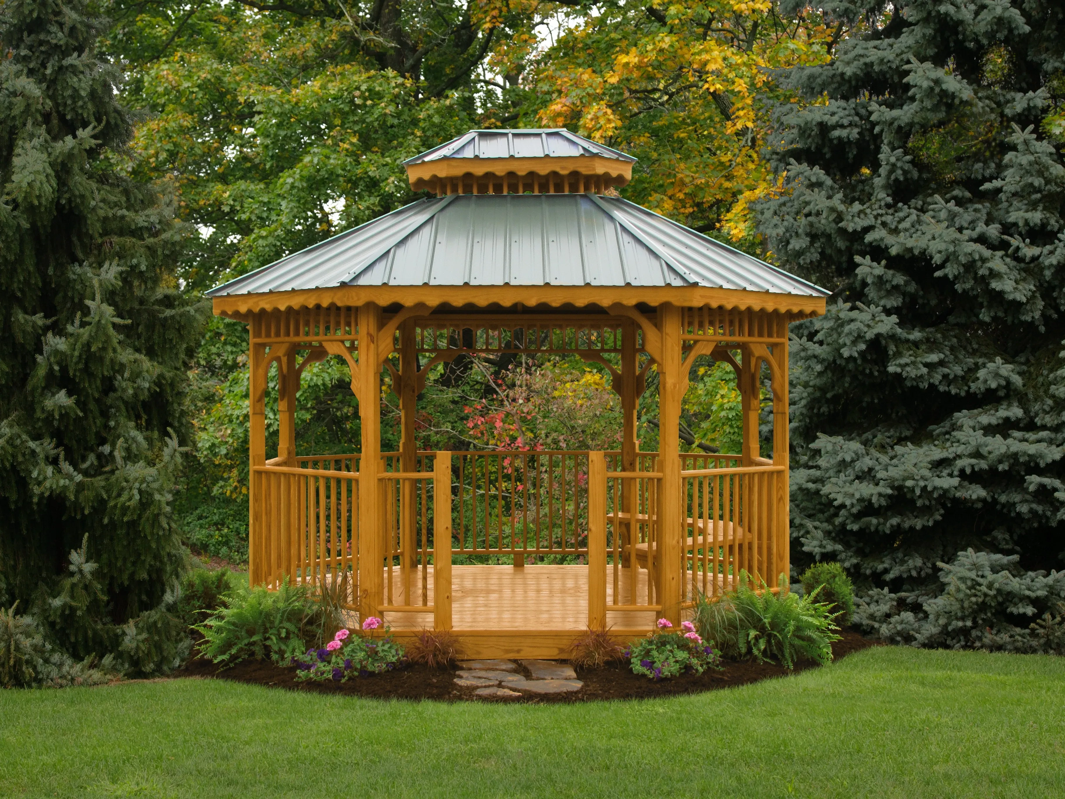 A deluxe wood gazebo in a beautifully landscaped setting