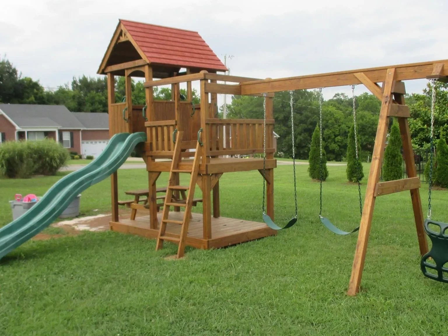A stained wood super tower playset