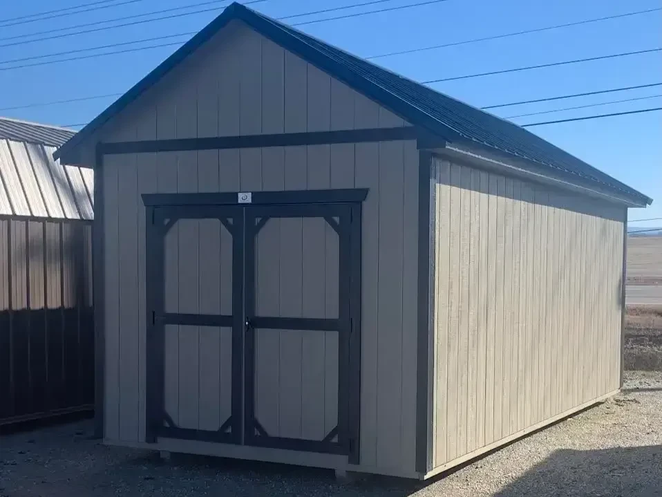 a wood utility shed with a roof overhang and 72" double doors