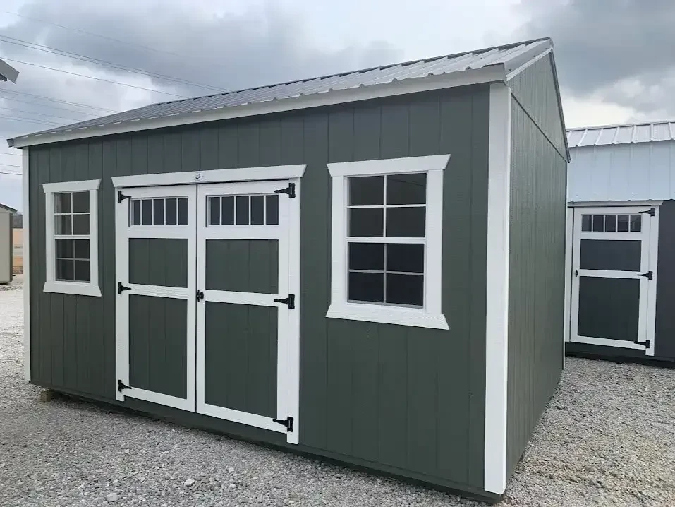 an avocado colored garden shed with transom windows in the double doors, and a 2x3 window on each side of the double doors