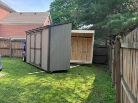 two halves of a split shed being installed