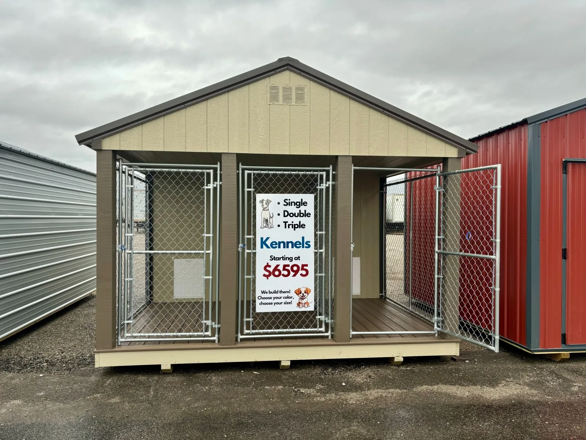 a 3 bay dog kennel with chain link runs. The right chain link run gate is open.