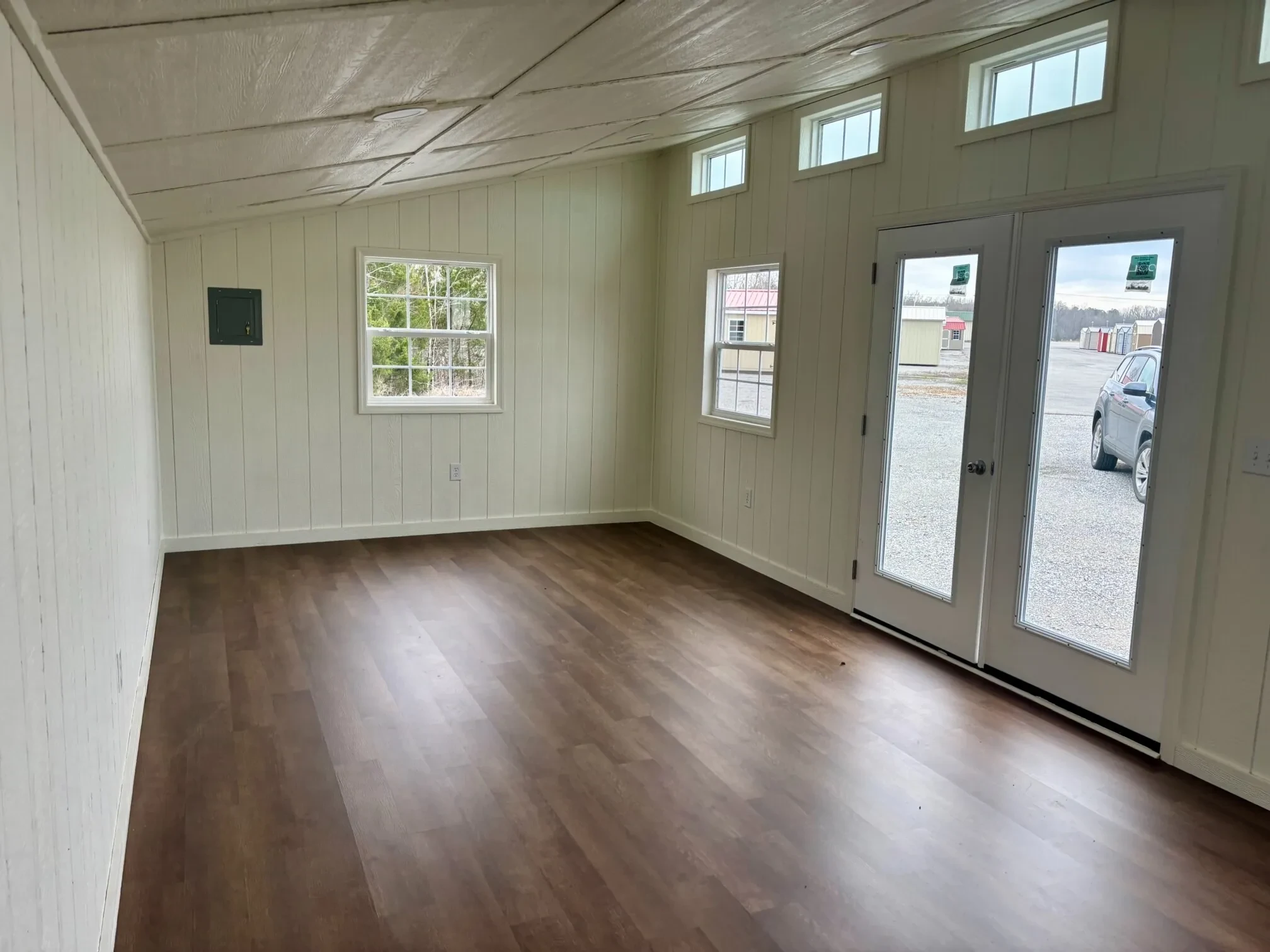 inside a studio shed looking towards the left wall. It it completely finished out, it looks like a very comfortable room.