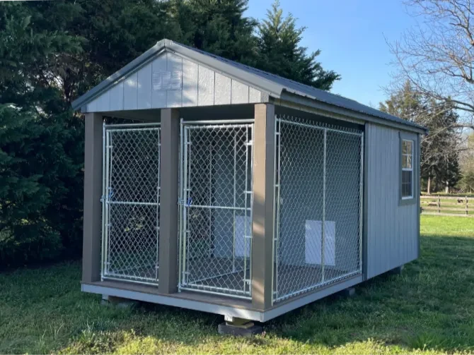 a dog kennel shed with two separate pens