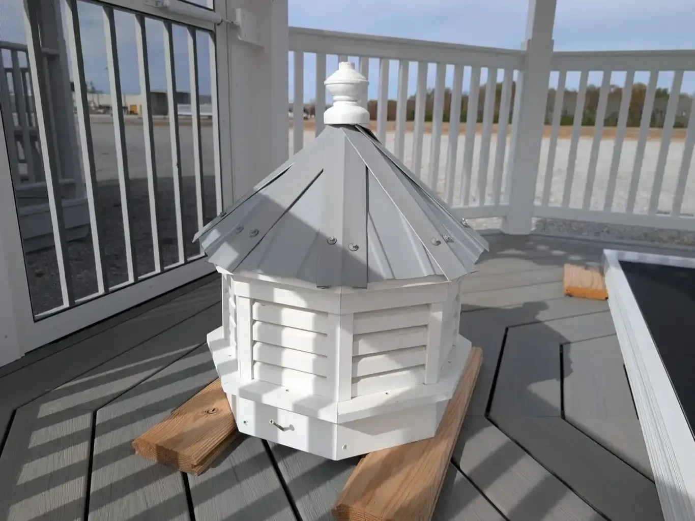 a small white cupola with grey roof metal that goes on top of a gazebo