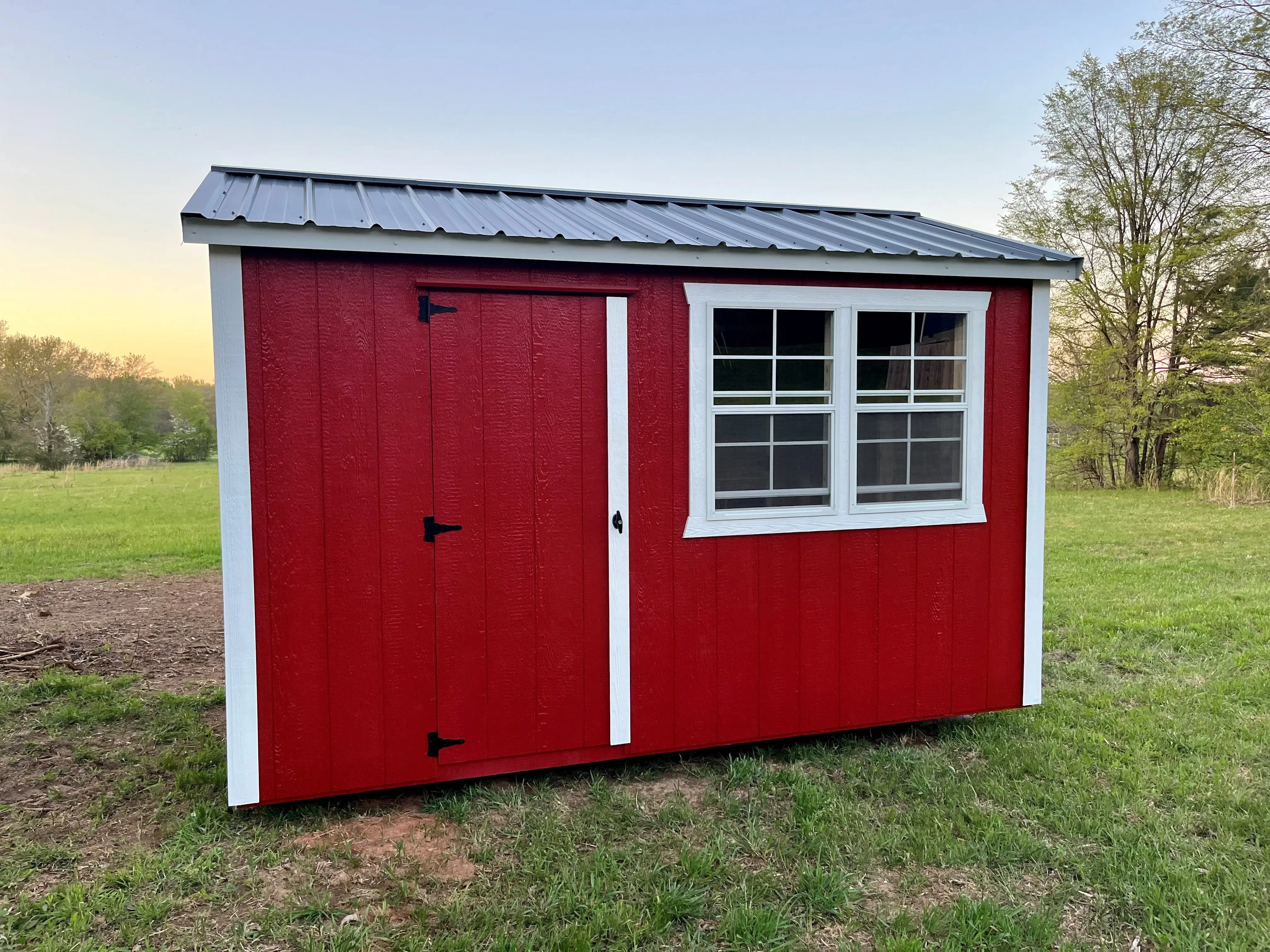 a red and white chicken coop