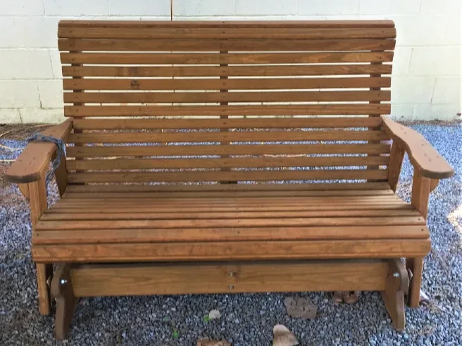 5' Wood Rollback glider setting on gravel