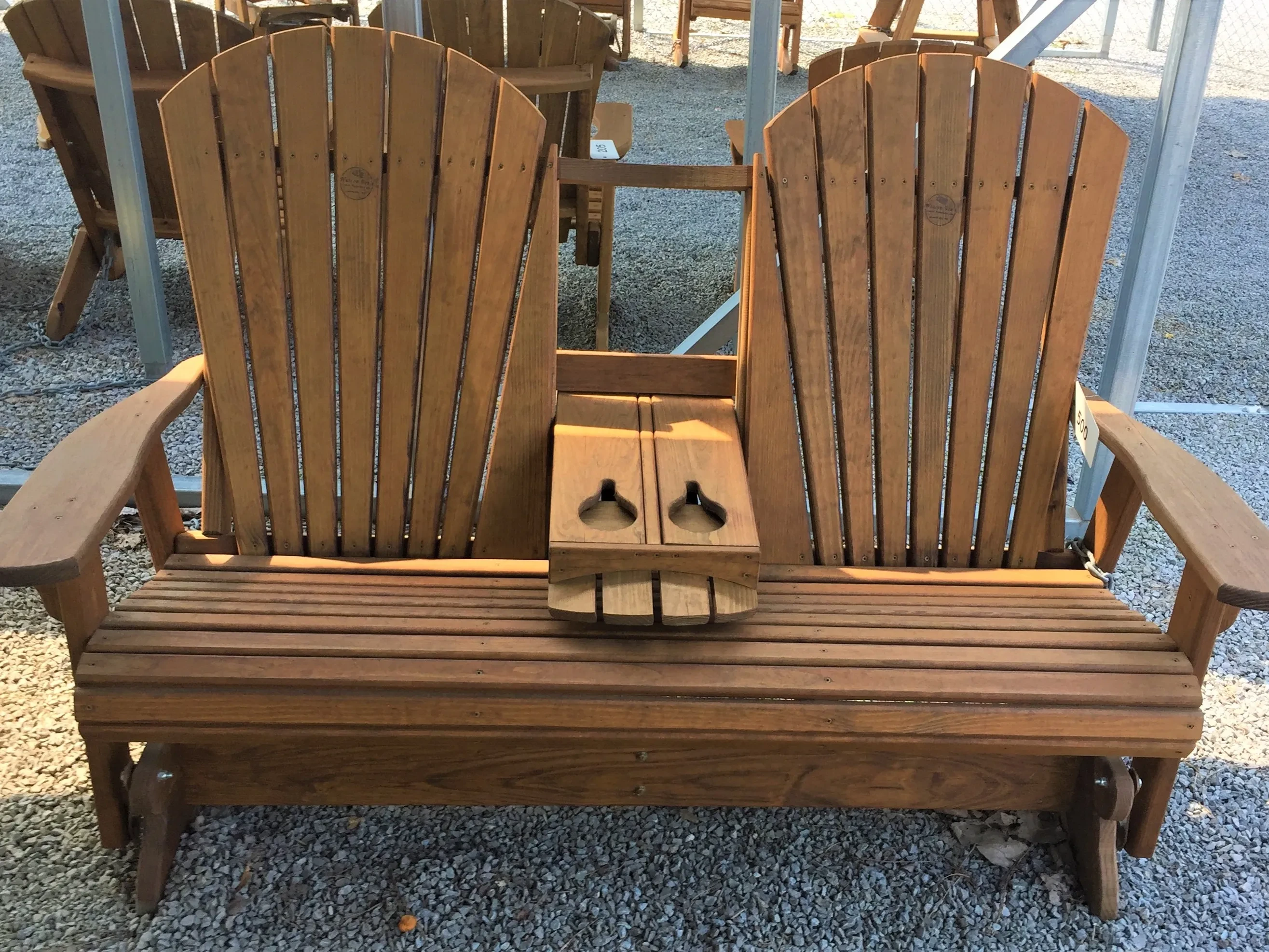 Flip down console glider sitting on gravel