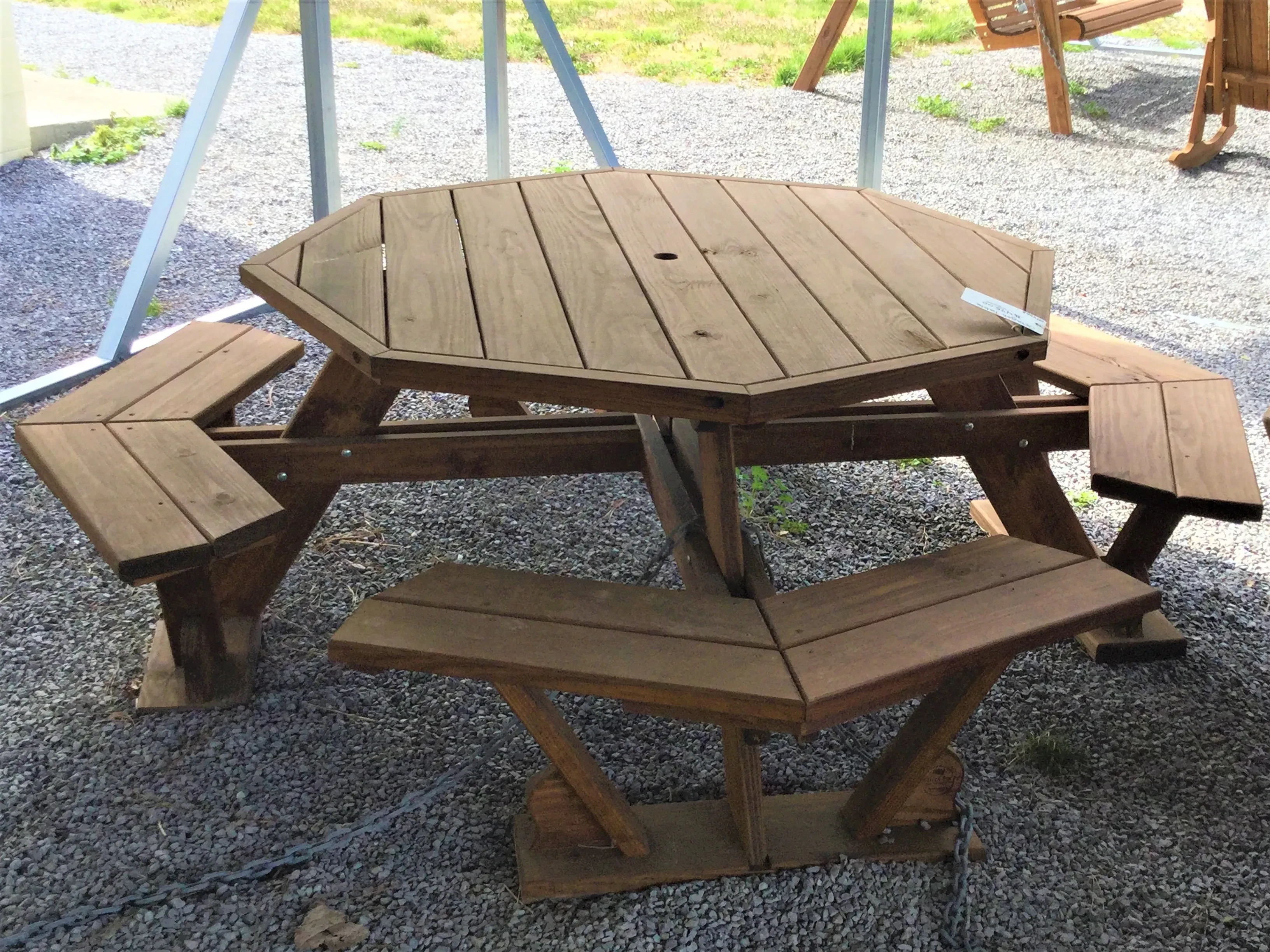 Wood Octagon table setting on gravel