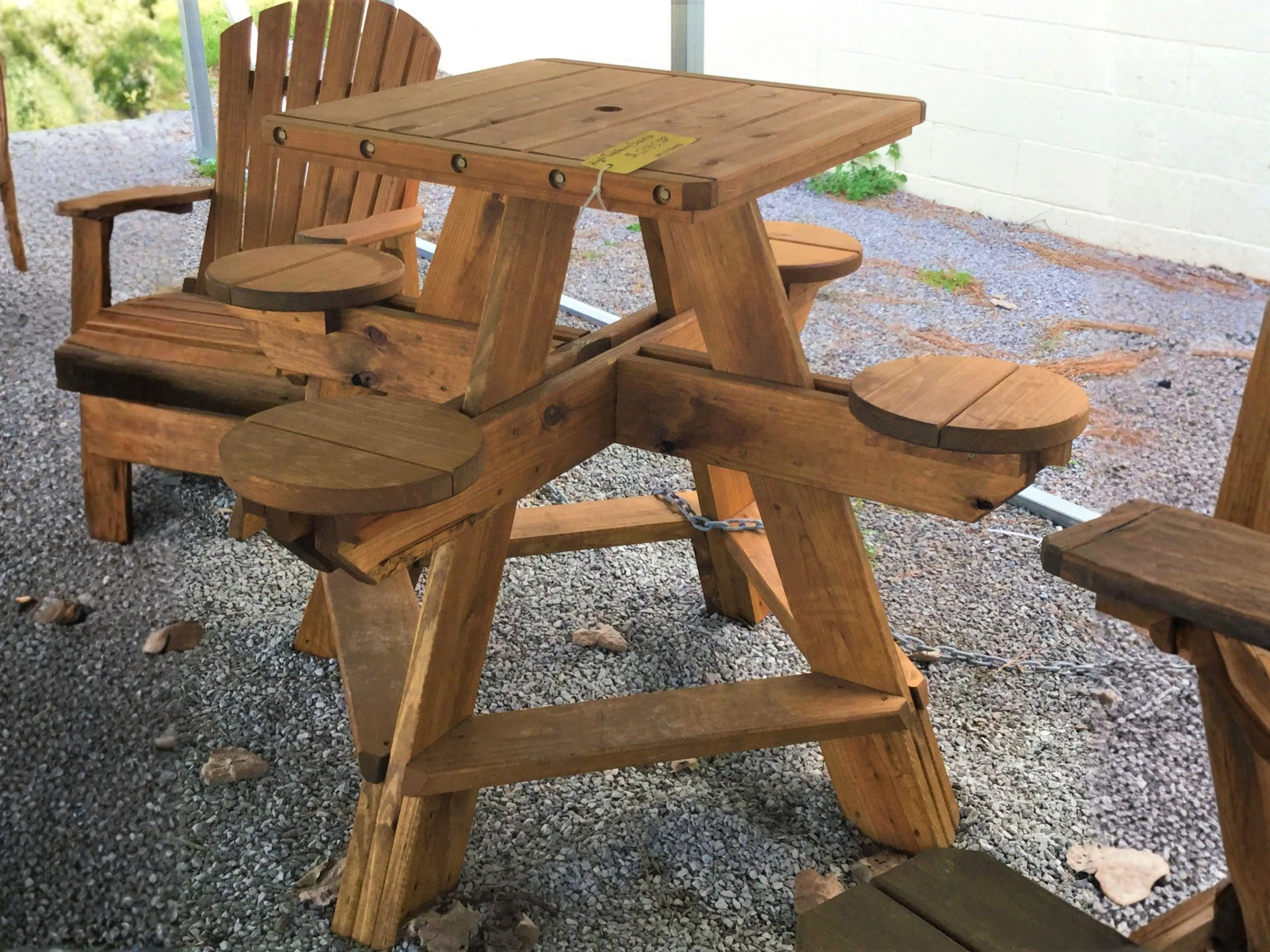 Wood 4-Seat High Top Table on gravel
