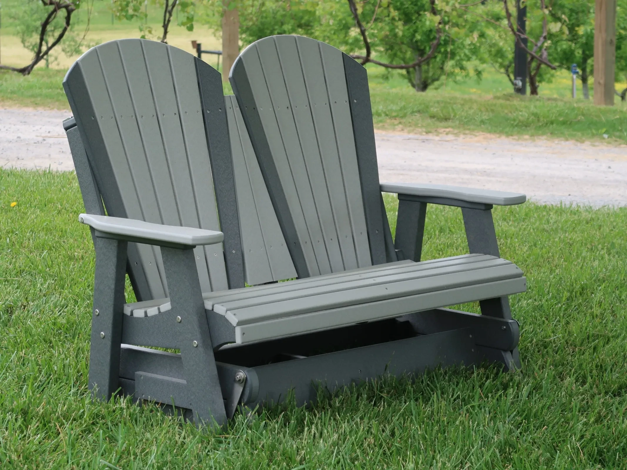 Polywood double glider in the grass